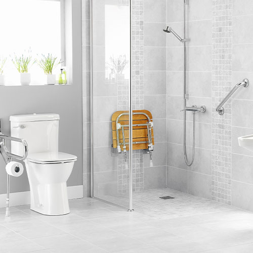 Image of bathroom featuring safety equipment like grab bar on wall and shower seat.